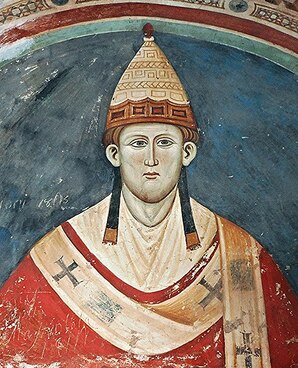 Fresco image of Innocent III looking very serious and having reddish hair
